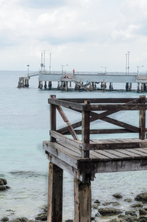 wood bridge with sea backgroundの写真素材