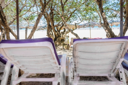 white beach chair and purple mattress  の写真素材