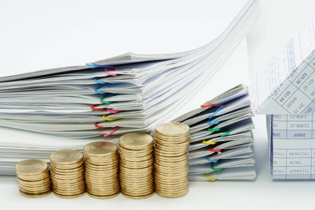 Step pile of gold coins and house with pile overload document with colorful paperclip on white background.の写真素材