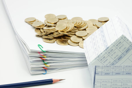 Pencil and pile overload document of report with colorful paperclip with house and pile of gold coins on white background.の写真素材