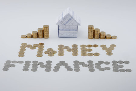 House and split step pile of gold coins on white background.の写真素材