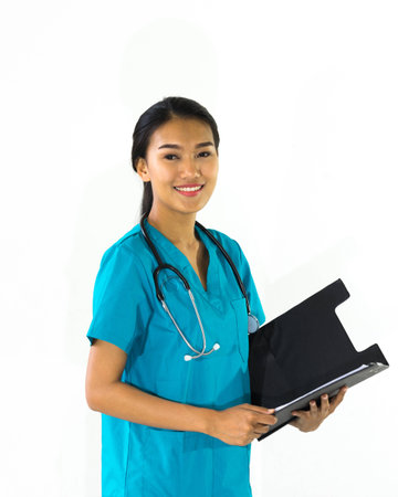 Smiling young medical doctor woman with stethoscope on white background.の写真素材