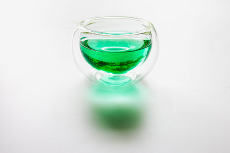 A glass of tea on white background