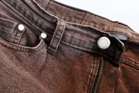 torn old brown jeans background,dirty pants の写真素材