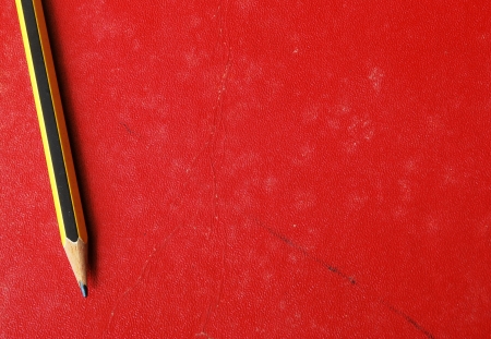Red old page with pencilの写真素材