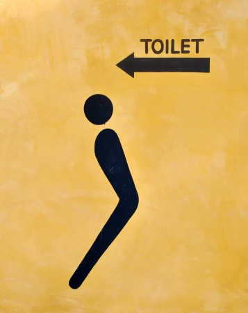toilet symbol on yellow backgroundの写真素材