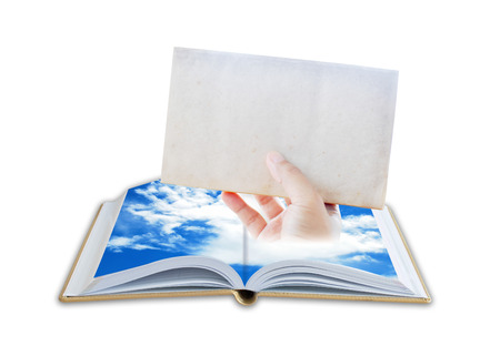 Hand holding empty page from bookの写真素材