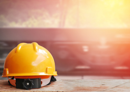 Safety helmet with railway construction backgroundの写真素材