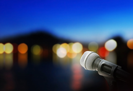 Microphone on stage backgroundの写真素材