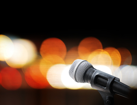 Microphone on stage backgroundの写真素材