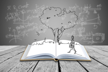 pen book with freehand sketching on formulas backgroundの写真素材
