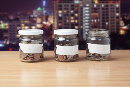 Bottles of coins for saving or useful in the futureの写真素材