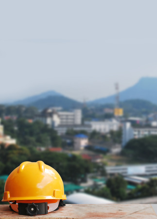Safety helmet with construction site backgroundの写真素材