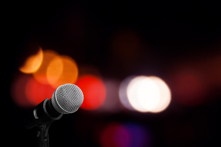 Microphone on stage backgroundの写真素材