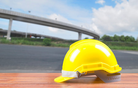 Safety helmet with construction site backgroundの写真素材