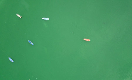 Aerial top view with fishing boat and sea beach background