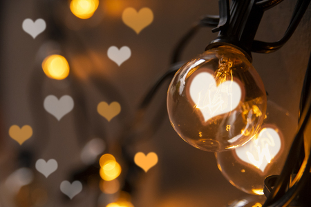 Light bulb with heart shape lighting for Valentine's dayの写真素材