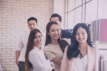 Group of young people in business after working in meeting roomの写真素材