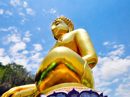 Beautiful Golden Buddha statue, at public temple, Wat Phabuddha navarantur - Golden Triangle in Chiang Rai,Thailand.の写真素材