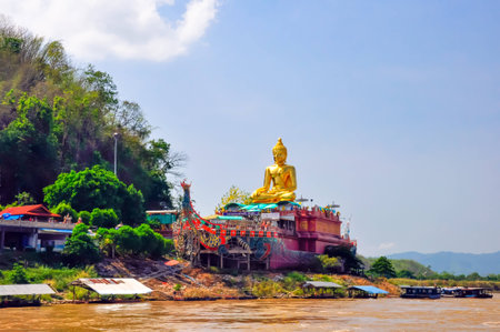 Beautiful Golden Buddha statue, at public temple, Wat Phabuddha navarantur - Golden Triangle in Chiang Rai,Thailand.の写真素材