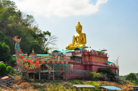 Beautiful Golden Buddha statue, at public temple, Wat Phabuddha navarantur - Golden Triangle in Chiang Rai,Thailand.の写真素材