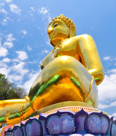Beautiful Golden Buddha statue, at public temple, Wat Phabuddha navarantur - Golden Triangle in Chiang Rai,Thailand.の写真素材