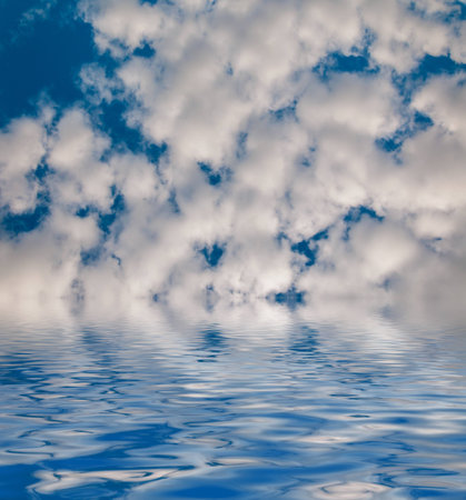 Beauty Surface Rippled of water with clouds and sky backgroundの写真素材