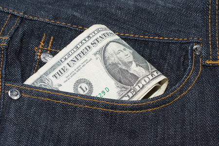 Loose Change Pocket Money Concept American Dollar Billsの写真素材
