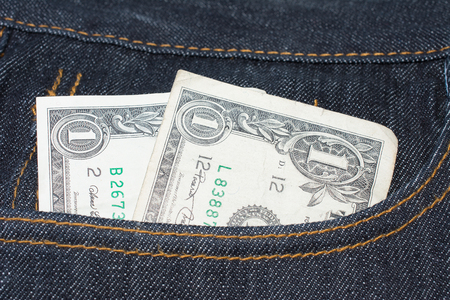 Loose Change Pocket Money Concept American Dollar Billsの写真素材