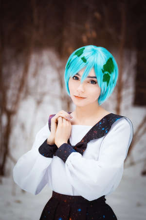Cute young girl portrait in cosplay school uniform in winter outdoorsの写真素材