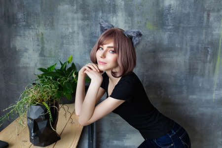 Portrait of a young attractive girl wearing cat ears cosplayの写真素材