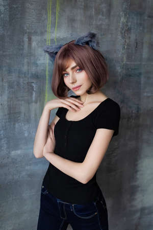 Portrait of a young attractive girl wearing cat ears cosplayの写真素材