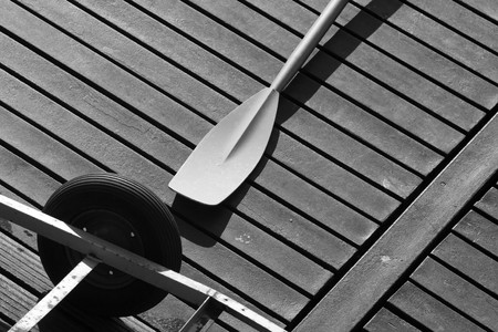 A paddle lying on the deckの写真素材