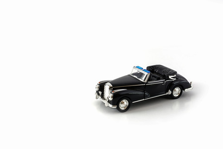 Ancient toy car isolated on whiteの写真素材