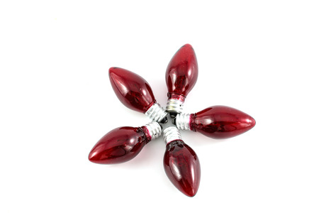 Red light bulb on white backgroundの写真素材