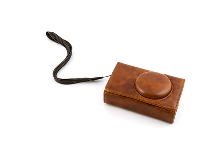 camera with a leather case isolated on white