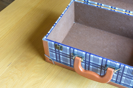 open baggage on wooden tableの写真素材