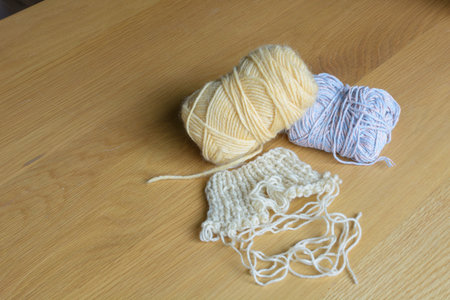 balls of wool on  wooden table
