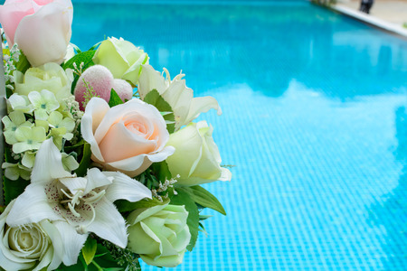 bouquet next to the swimming poolの写真素材