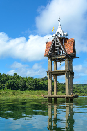 top of roof of ancient temple flood in Sangkhlaburi, Karnchanaburi, Thailandの写真素材