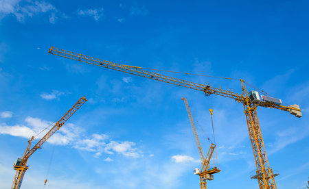 construction cranes with blue sky