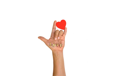 Hand with heart and letter LOVE on white backgroundの写真素材