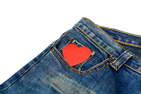 Blue jean isolated on white focus on red heartの写真素材