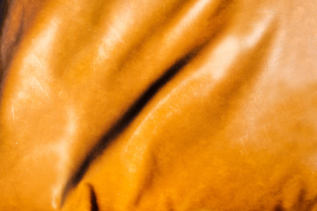 brown crumpled leather textured backgroundの写真素材