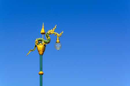 King of nagas lamp with blue sky background, Thai styleの写真素材