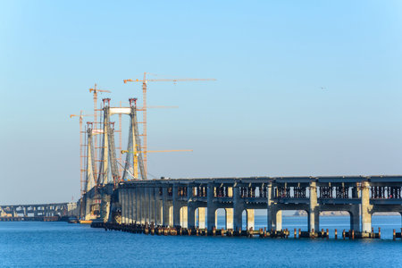 Construction site of bridge building across the seaの写真素材