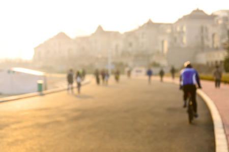 People walking in the park relaxation. Blurry image with sunlightの写真素材