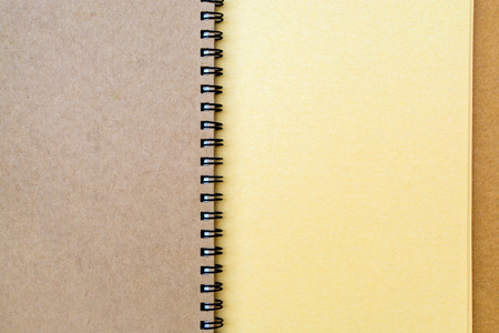 Close up of brown notebook with spiral and copy spaceの写真素材