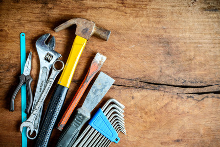 Set of work tools on old grunge wooden background with copy space