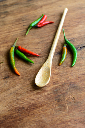 Close up of chilli pepper on old wood backgroundの写真素材